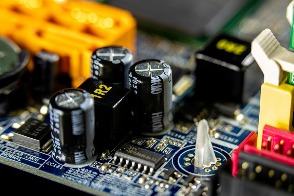 pexels-photo-6636477-6636477 Detailed view of electronic components on a circuit board for computer technology.